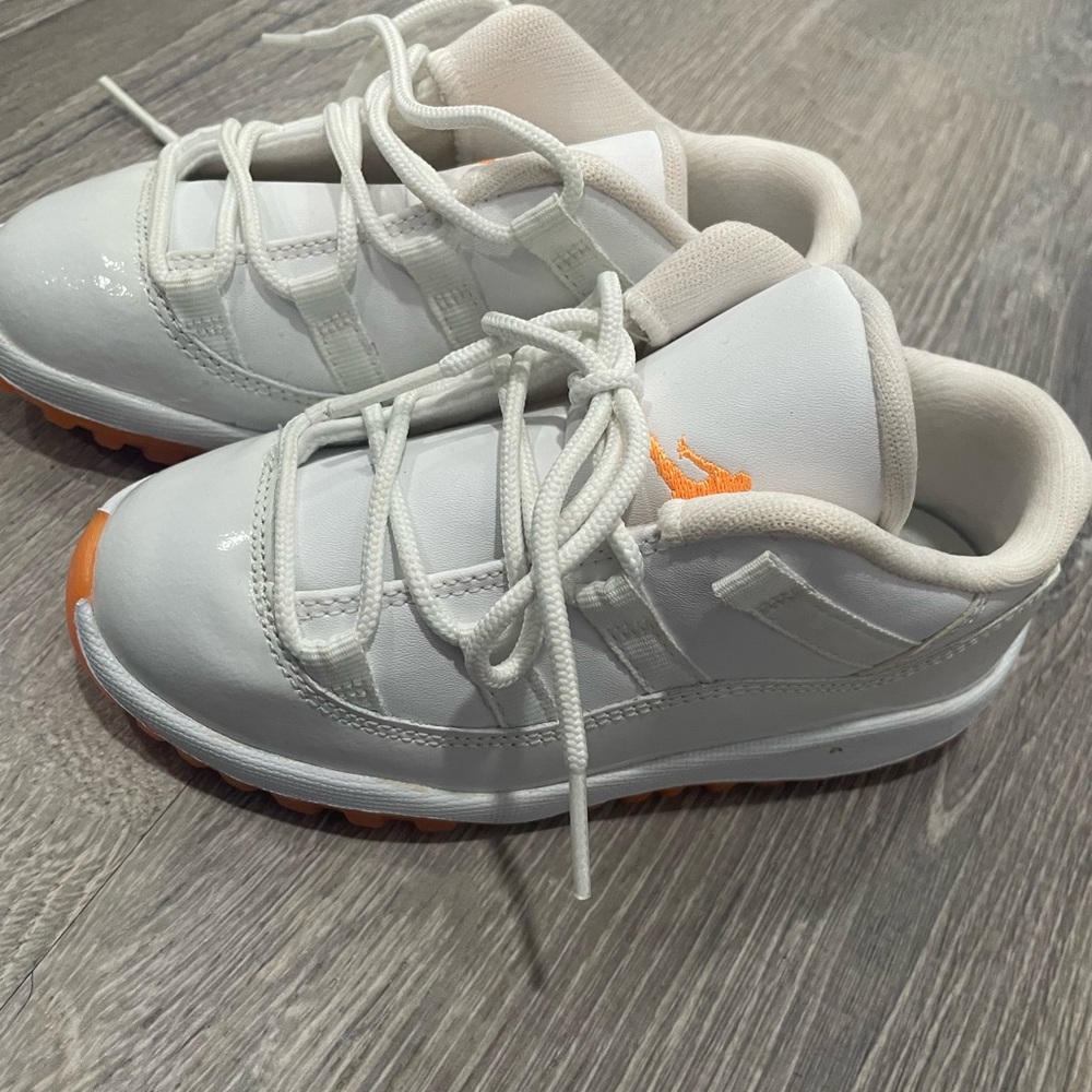 orange and white Jordan’s